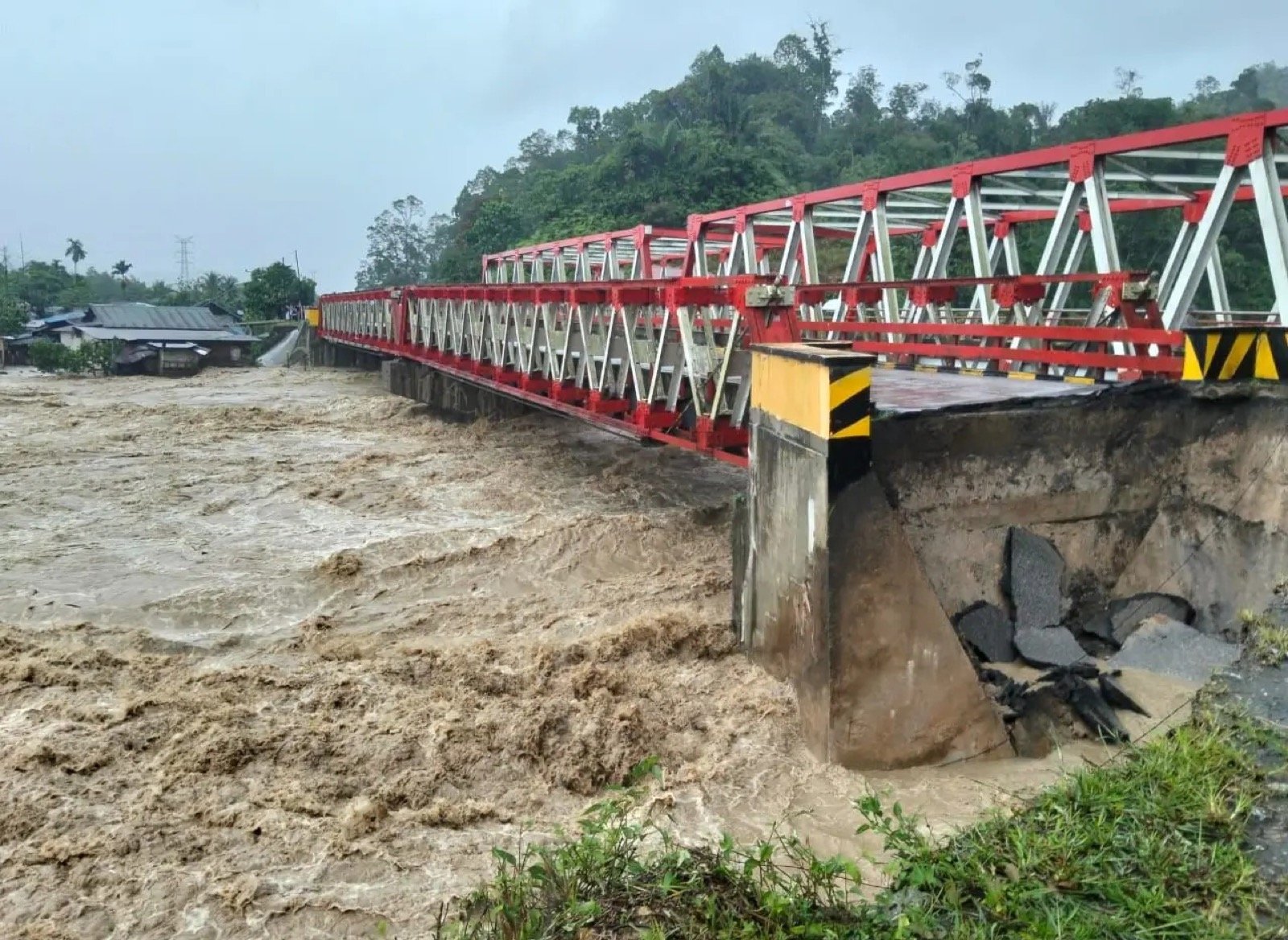 Flood-damaged roads and bridge interruption