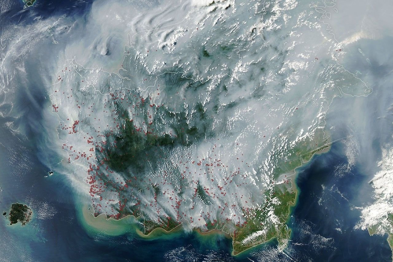 Forest fire and smoke-obscured area